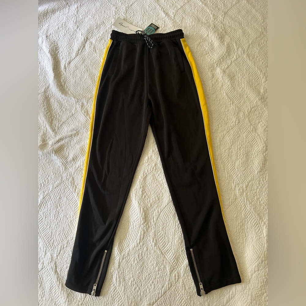 NWT nAna judy streetwear Iris Black Track Pant.Small. Gold side stripe. Zippers